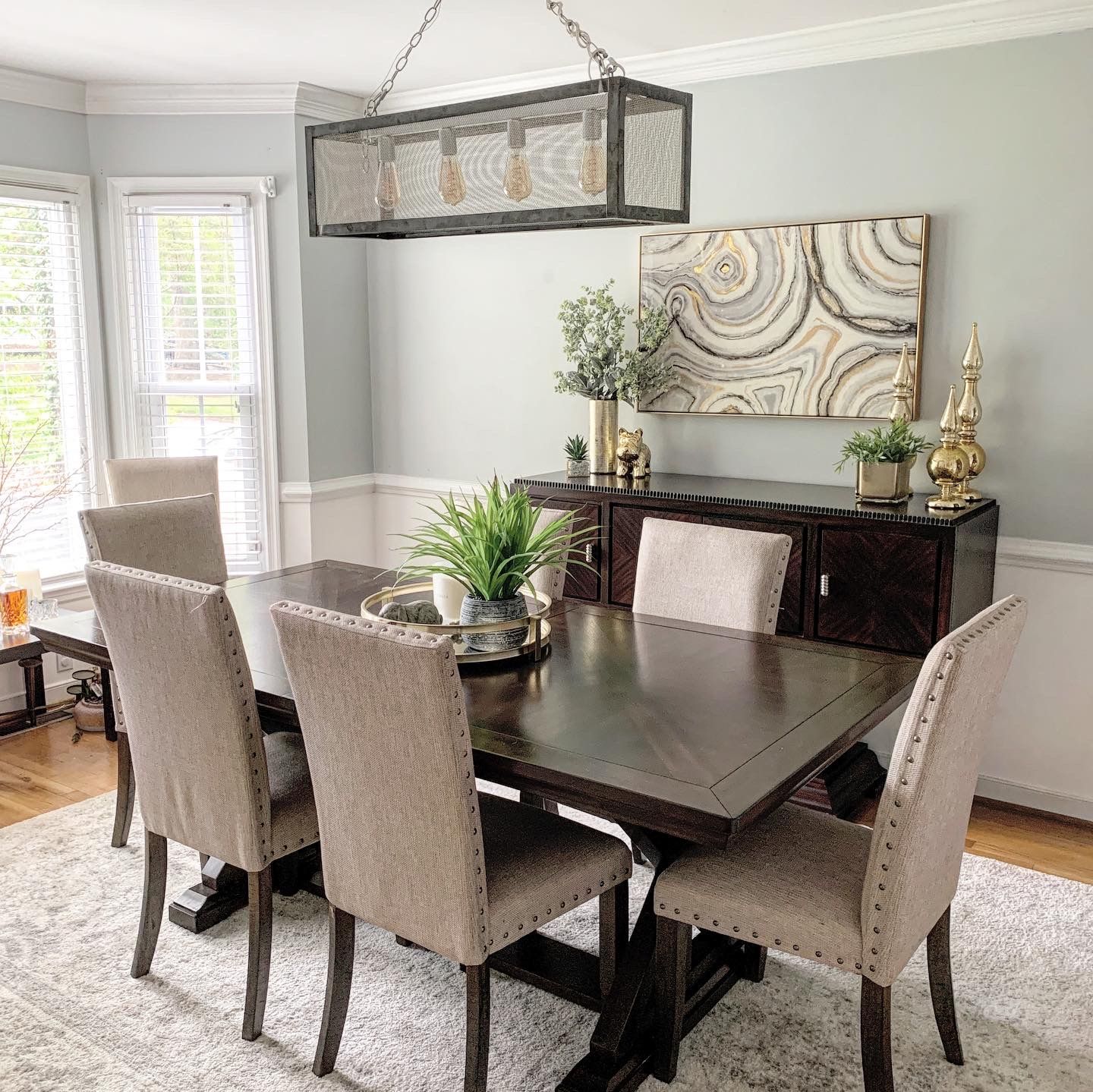 Contemporary Dining Room with Neutral Tones and Modern Lighting