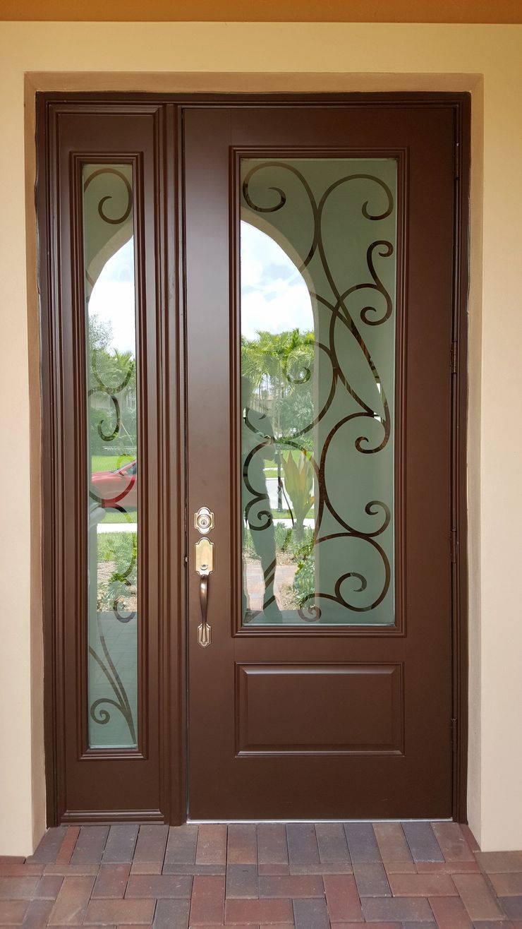 Brown Front Door with Decorative Glass and Wrought Iron Scrollwork