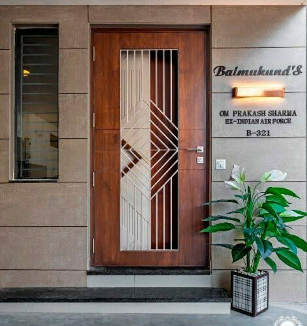 Contemporary Main Entry Door with Geometric Metal Inlay