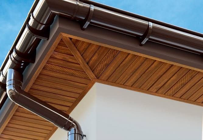 Modern House Eaves with Wood Paneling and Gutter System