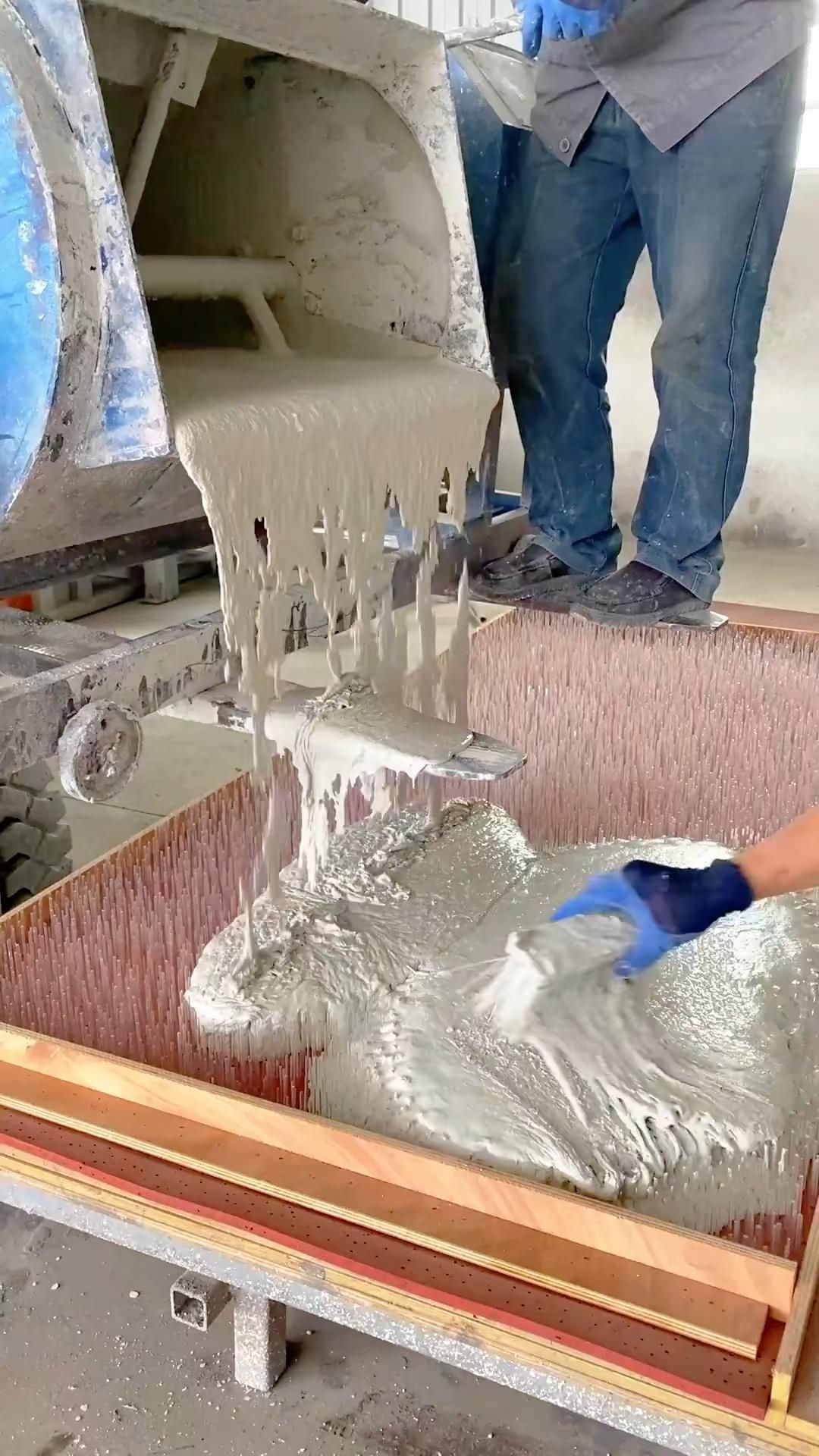 Fresh Concrete Pouring into Custom Mold