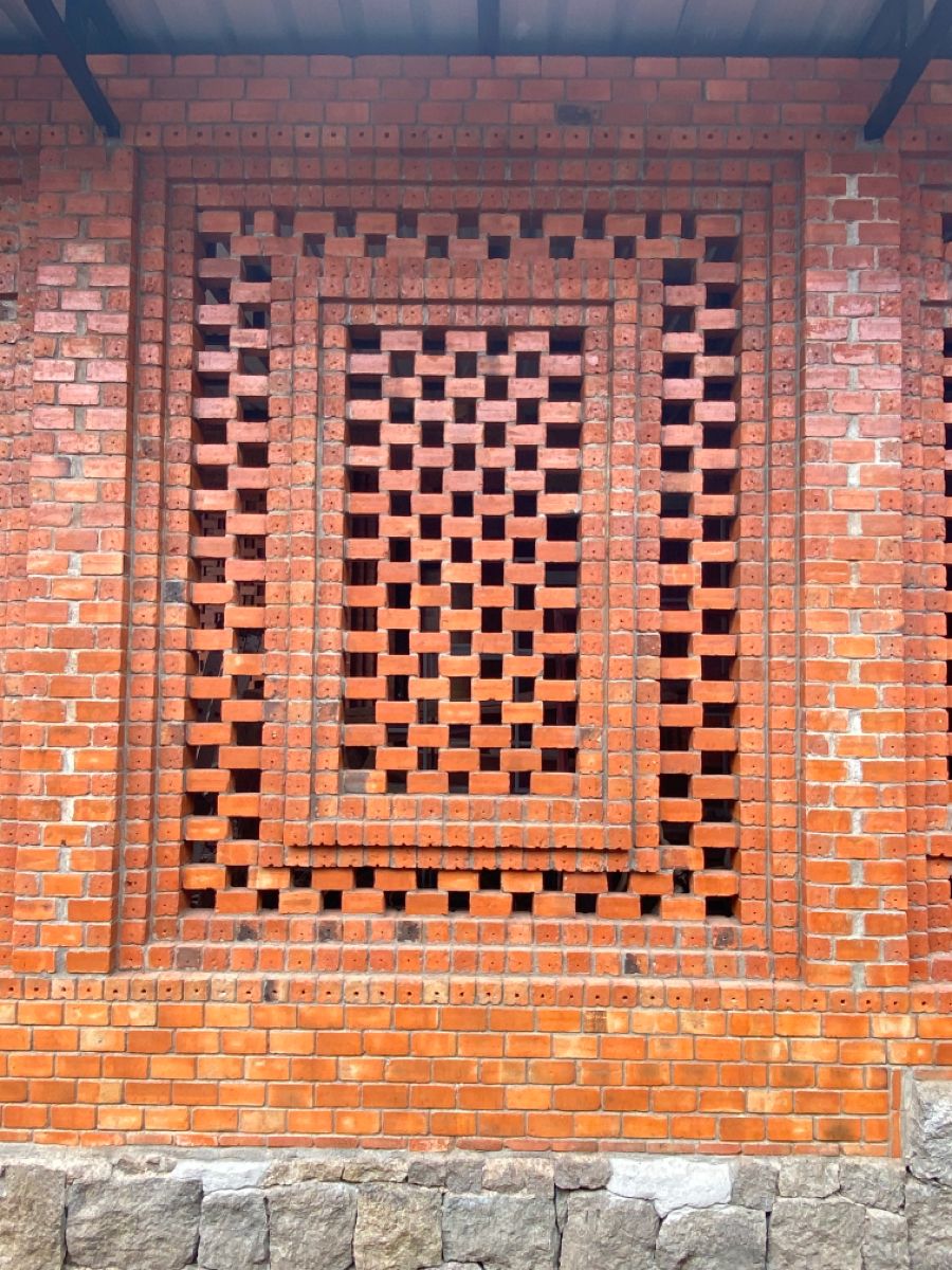 Geometric Perforated Brick Wall Feature With Stone Base