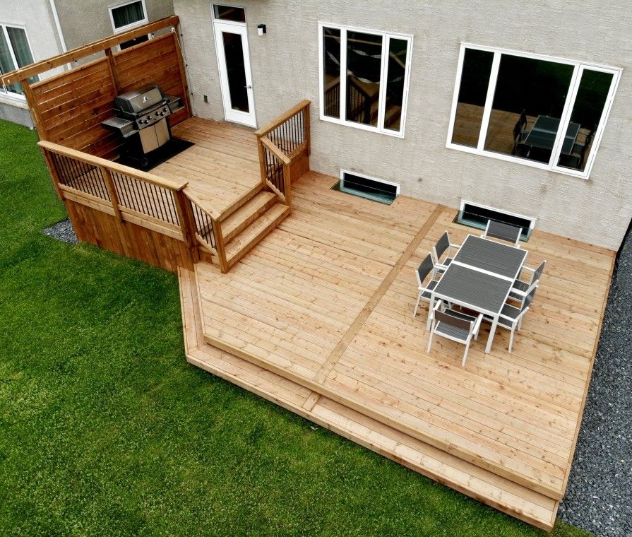 Spacious Multi-Level Wood Deck with Dining and Grill Area