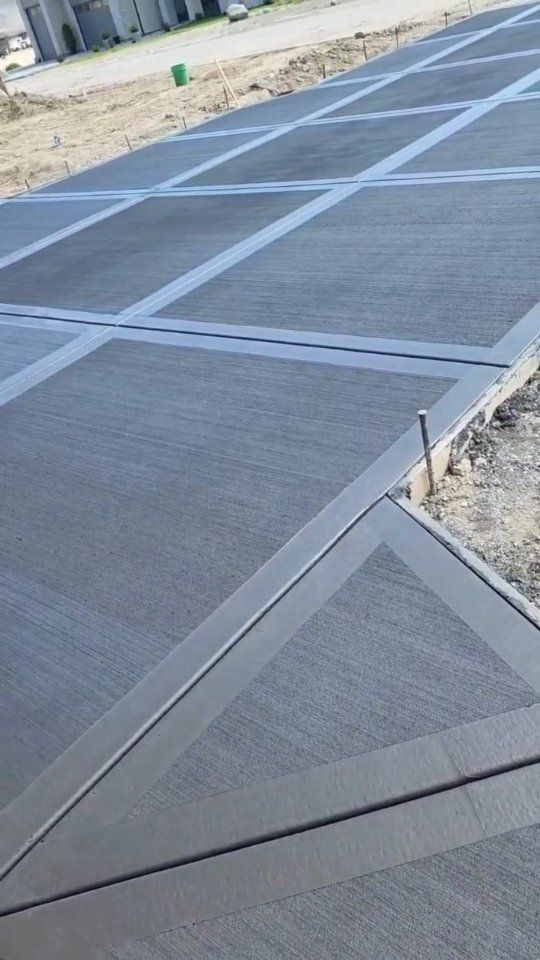 Modern Brushed Concrete Driveway with Geometric Grid Pattern