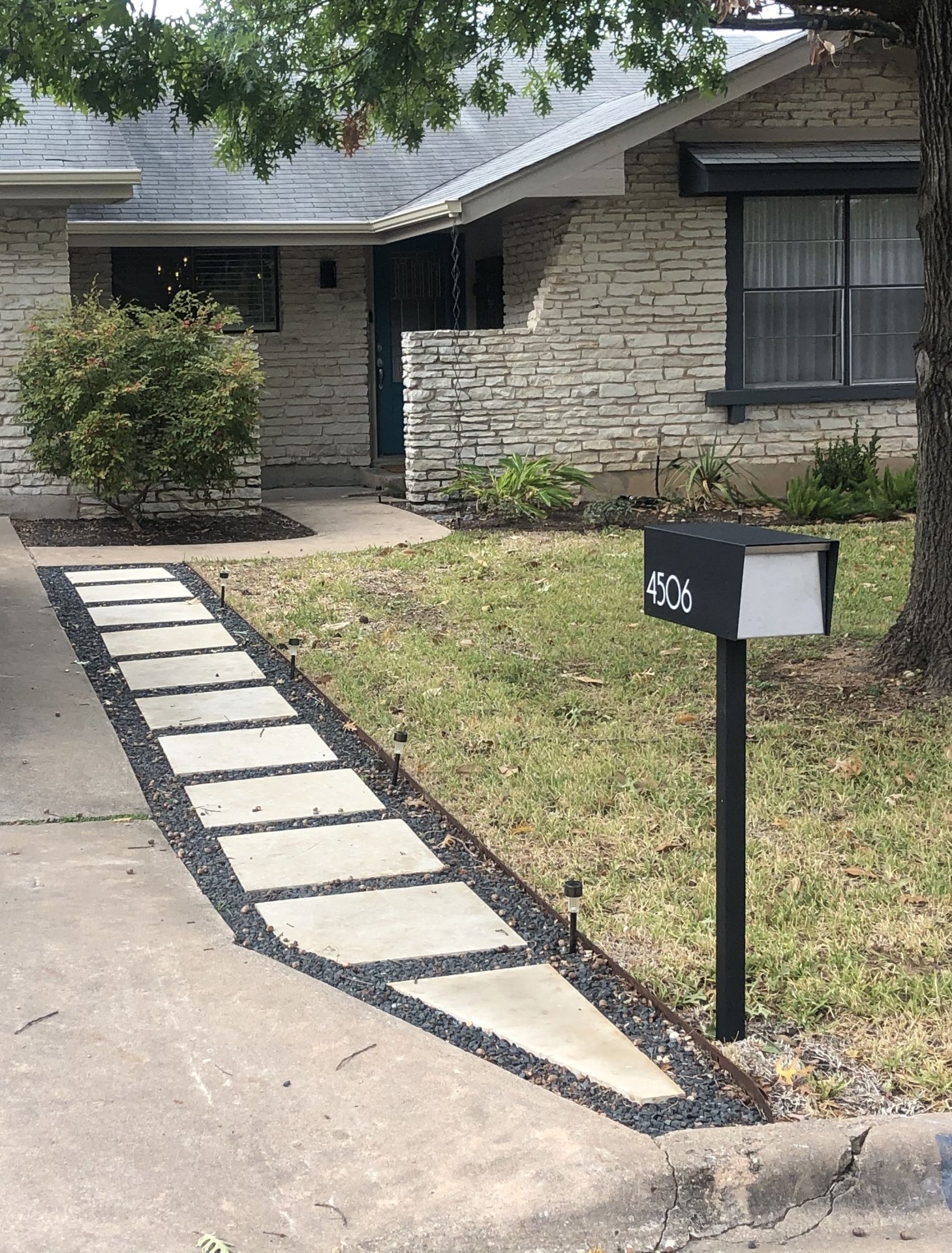 Modern Concrete Paver Walkway with Black Gravel Border and Mailbox