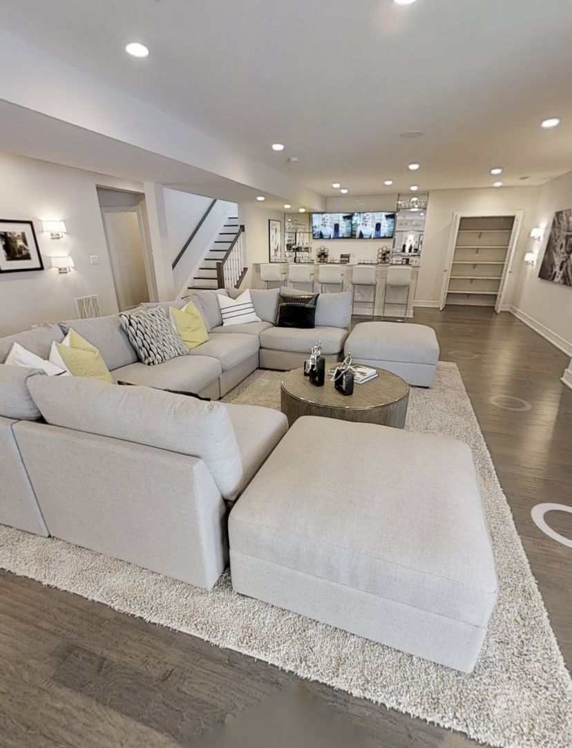 Spacious Modern Living Room With Sectional Sofa and Home Bar
